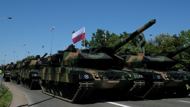 Leopard 2 battle tanks during the Armed Forces Day military parade Warsaw, Poland, on Tuesday, Aug. 15, 2023. Earlier this month, Deputy Interior Minister Maciej Wasik called for the “complete isolation” of Belarus as Warsaw deployed more troops to the border in response to what it called an airspace violation by Belarusian helicopters.