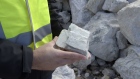 A geologist holds a rock containing spodumene, a lithium raw material, for a photograph at the Bald Hill lithium mine site, co-owned by Tawana Resources Ltd. and Alliance Mineral Assets Ltd., outside of Widgiemooltha, Australia, on Monday, Aug. 6, 2018. Australia’s newest lithium exporter Tawana is in talks with potential customers over expansion of its Bald Hill mine and sees no risk of an oversupply that would send prices lower. Photographer: Carla Gottgens/Bloomberg