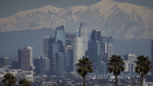 The snow-covered San Gabriel mountain range past the downtown Los Angeles skyline after a winter storm in Los Angeles, California, US, on Thursday, March 2, 2023. A sprawling winter storm last week put a substantial dent in California's historic water shortage with less than half of its land now in drought for the first time since 2020.