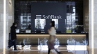 The SoftBank Corp. logo behind a reception counter in the entrance hall inside the Tokyo Portcity Takeshiba building, which houses SoftBank Group's headquarters, in Tokyo, Japan, on Friday, Feb. 5, 2021. SoftBank Group is scheduled to release earnings figures on Feb. 8. Photographer: Kiyoshi Ota/Bloomberg