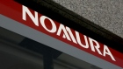 The Nomura Holdings Inc. logo is displayed outside a Nomura Securities Co. branch in Tokyo, Japan, on Wednesday, Nov. 30, 2016.  Photographer: Yuriko Nakao/Bloomberg