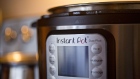 An Instant Brands Inc. Instant Pot is arranged for a photograph in Arlington, Virginia, U.S., on Tuesday, March 5, 2019. Corelle Brands LLC, the maker of Pyrex and CorningWare kitchen products, agreed to merge with Instant Brands, the company behind the popular Instant Pot cooker.