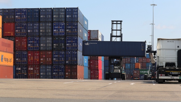 A forklift transports a Cronos Containers Ltd. shipping container at Duisburg Intermodal Terminal (DIT) at Duisport port in Duisburg, Germany, on Wednesday, Aug. 14, 2019. In Germany, second-quarter output was damped by trade, with exports falling faster than imports.