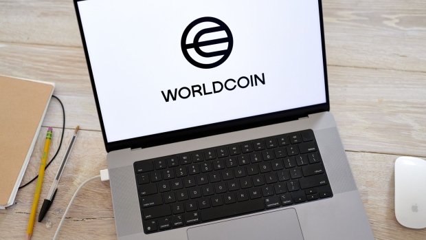 The Worldcoin logo on a laptop arranged in Germantown, New York, US, on Monday, July 24, 2023. Worldcoin, the digital identity and crypto payments project co-founded by OpenAI Chief Executive Officer Sam Altman, launched on Monday. Photographer: Gabby Jones/Bloomberg