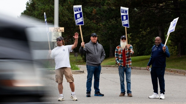 United Auto Workers (UAW) members and supporters on a picket line outside the General Motors Co. Flint Processing Center in Swartz Creek, Michigan, US, on Monday, Sept. 25, 2023. General Motors and Stellantis NV face walkouts at 38 more facilities as talks with their workers' union failed to make headway, even as Ford Motor Co. was spared the escalation after making progress in the negotiations.