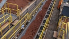 Workers monitor ore bauxite travelling a conveyor at the Vedanta Ltd. Alumina Refinery in Lanjigarh district, Odisha, India, on Tuesday, June 18, 2019. Vedanta Resources Ltd., owned by Indian billionaire Anil Agarwal, mines and processes copper, zinc and aluminum seams with a focus on India, but has operations in Zambia, Sri Lanka, South Africa and Australia as well.