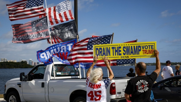 Supporters of former US President Donald Trump outside Mar-A-Lago in Palm Beach, Florida, US, on Wednesday, March 22, 2023. Trump says he expects he'll soon be charged in New York with making hush-money payments to a porn star.