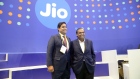 Mukesh Ambani, chairman of Reliance Industries Ltd., right, with his son Akash Ambani, chairman of Reliance Jio Infocomm Ltd., visit a company's stall at India Mobile Congress 2022 in New Delhi, India, on Saturday, Oct. 1, 2022. Narendra Modi, India's prime minister, announced the launch of 5G services in India during the event on Oct. 1. Photographer: Prakash Singh/Bloomberg