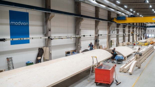The Modvion factory in Gothenburg, on July 3. Wood is making a comeback in the net zero age, with timber high-rises, corporate campuses and Olympic Village housing all in the works. Photographer: Frederik Lerneryd/Bloomberg