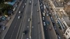 Vehicles travel along a highway in an aerial photograph taken in Delhi, India, on Friday, Sept. 4, 2020. India’s oil-product demand is set to slump to a five-year low this financial year, with a bleak outlook for diesel consumption as the nation’s truck operators idle vehicles and consider cutting the size of their fleets.