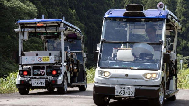 Self-driving vehicles with the level-4 autonomous driving technology on a walking trail in Eiheiji, Fukui, Japan, on Saturday, Aug. 19, 2023. Photographer: Buddhika Weerasinghe/Bloomberg 