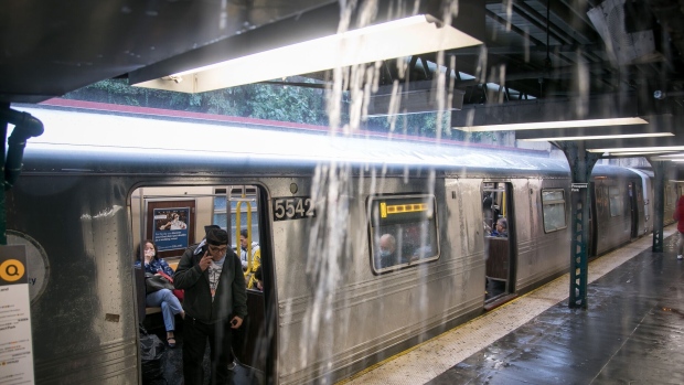 Rain leaks from the ceiling in front of a train before it is taken out of service at a subway station during a rain storm in the Brooklyn borough of New York, US, on Friday, Sept. 29. 2023. Multiple New York City subway lines were shut and streets inundated after torrential rain pelted the metropolitan area, prompting warnings about flooding in the city as well as Long Island, Connecticut and New Jersey.