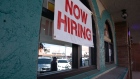 A "Now Hiring" sign outside a restaurant in Huntington Park, California, U.S., on Wednesday, March 24, 2021. The U.S. economy is on a multi-speed track as minorities in some cities find themselves left behind by the overall boom in hiring, according to a Bloomberg analysis of about a dozen metro areas. Photographer: Jessica Pons/Bloomberg
