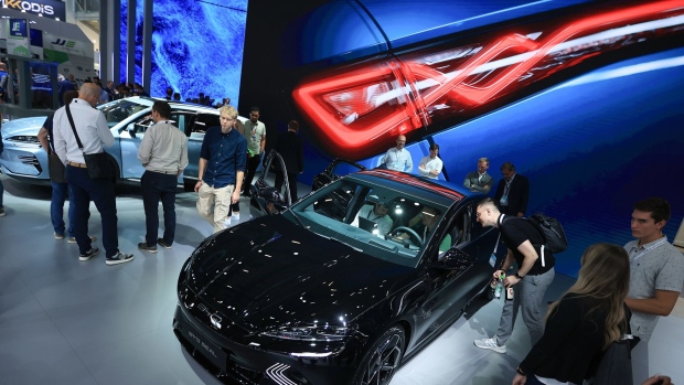 Visitors inspect a BYD Co. Seal electric sedan on day two of the Munich Motor Show (IAA) in Munich, Germany, on Wednesday, Sept. 6, 2023. Europe's automakers are showing off their latest battery-powered vehicles at the IAA Mobility car show this week as they try to challenge Tesla Inc. and fend off growing competition from China.