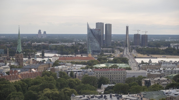 The skyscraper offices of Swedbank AB stand on the city skyline beside the Vansu bridge in Riga, Latvia, on Wednesday, June 13, 2018. Latvia's plans to kick out risky cash from its scandal-plagued banks are about to accelerate.