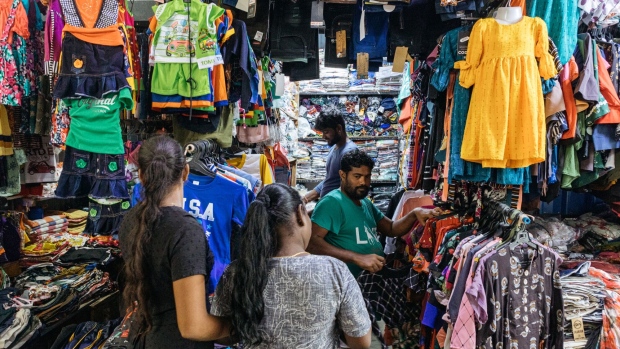 People browse clothes at a store in Jaffna, Sri Lanka, on Monday, Oct. 24, 2022. Sri Lanka’s 70% inflation is hitting its peak as crippling shortages ease and bailout funds look within reach, yet it’s far from putting the central bank governor at ease.