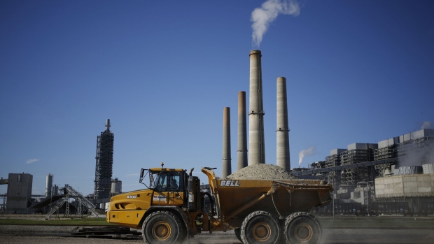 A dump truck drives through the grounds of a coal-fired power generating station in Thompsons, Texas.
