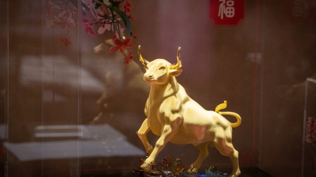 A gold ox figurine on display at a Luk Fook Holdings International Ltd. jewelry store in Beijing, China, on Monday, Feb. 8, 2021. Silver may be receding from the spotlight, but commodities markets are looking spritely ahead of a week that promises a flurry of much-watched outlooks, and the start of an unusual Lunar New Year break in top buyer China. Photographer: Yan Cong/Bloomberg