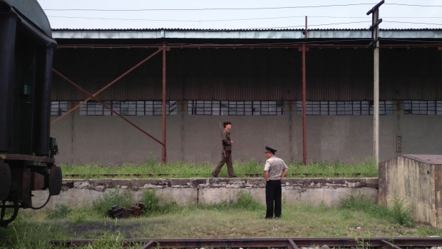 TUMANGANG, NORTH KOREA - AUGUST 19: Korean People's Army soilders guard Tumangang railway station on August 19, 2015 in Tumangang, North Korea. North and South Korea today came to an agreement to ease tensions following an exchange of artillery fire at the demilitarized border last week. (Photo by Xiaolu Chu/Getty Images)