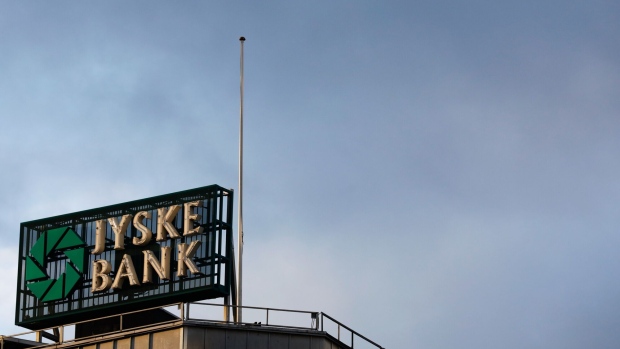 A sign sits on top of the offices of Jyske Bank A/S on Vestergarde, Copenhagen, Denmark, on Thursday, Jan. 3, 2019. For the first time in almost three years, the central bank of Denmark has bought kroner to support its euro peg through a direct intervention in the currency market. Photographer: Luke MacGregor/Bloomberg