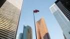 A Canadian flag flies in a courtyard in the financial district of Toronto, Ontario, Canada, on Monday, Jan. 16, 2023. The vacancy rate at Canadian office buildings reached a record high at the end of last year as companies cut back on space while new supply continued to hit the market.