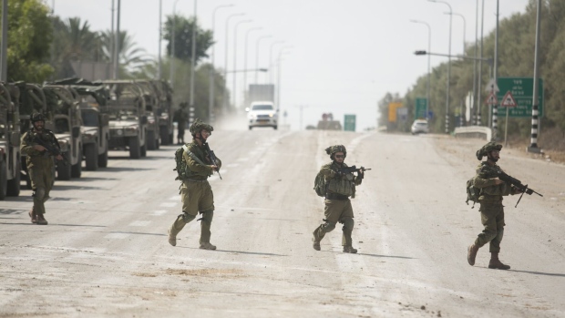Israeli soldiers near Kibbutz Kfar Aza close to the Gaza border on Oct. 10. 