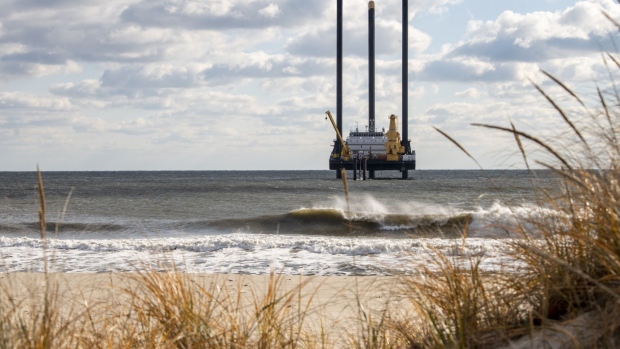 A lift boat off the beach near Wainscott, New York, US, on Thursday, Dec. 1, 2022. The vessel's drill will be used in the construction of the South Fork Wind farm that will bore tunnels to bring electricity from the offshore wind farm that should start generating power in late 2023.