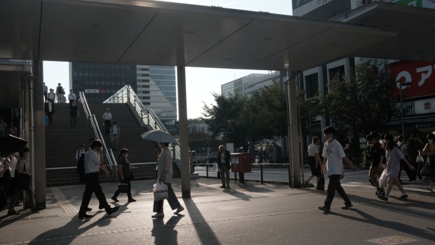 Pedestrians near Nakano station in Tokyo, Japan, on Monday, July 10, 2023. Eastern and western Japan will have a 60% chance of above-normal temperatures over the next monthly period, the Japan Meteorological Agency said in a forecast released last week. Photographer: Soichiro Koriyama/Bloomberg