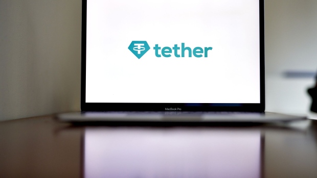 The Tether logo on a laptop computer arranged in the Brooklyn borough of New York, US, on Thursday, Nov. 17, 2022 Reverberations from the collapse of Sam Bankman-Fried’s empire continue to spread through financial markets, threatening the future of crypto lenders like BlockFi Inc. and Voyager Digital Ltd. Photographer: Gabby Jones/Bloomberg