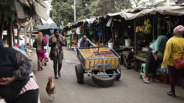 A worker pushes a cart past market shacks in Nairobi, Kenya, on Tuesday, July 25, 2023. The leader of Kenya’s main opposition coalition Raila Odinga said he’s ready to hold talks with the government even as he vowed to continue with demonstrations to demand tax cuts and an audit of last year’s elections that brought President William Ruto to power.