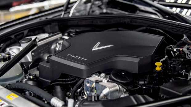 The VinFast logo sits on the engine cover of a VinFast Lux A 2.0 sedan as it moves through the final inspection area of the assembly line at the automaker's plant in Haiphong, Vietnam, on Friday, June 14, 2019. Real-estate conglomerate Vingroup JSC’s auto unit VinFast marked the rollout of its first vehicles from its assembly line on Friday, embodying the aspirations of the fast-developing country’s government to build a modern manufacturing sector. Photographer: Yen Duong/Bloomberg