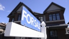 'For Sale' sign on home