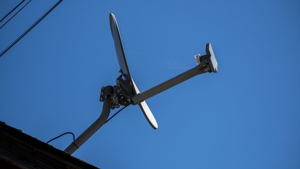 A Dish Network satellite dish on the roof of a home in Crockett, California, US, on Monday, July 31, 2023. Dish Network Corp. is scheduled to release earnings figures on August 3. Photographer: David Paul Morris/Bloomberg