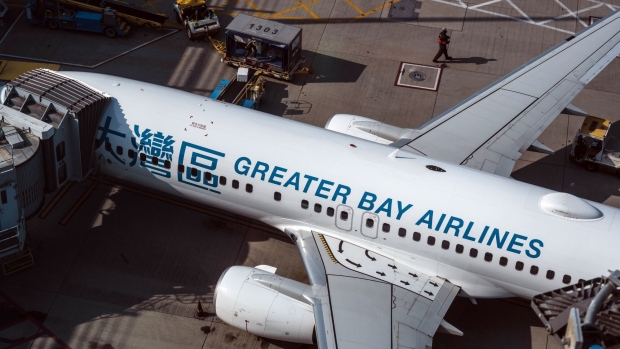 A Greater Bay Airlines Co. aircraft at Hong Kong International Airport in Hong Kong, China, on Friday, Feb. 17, 2023. A scarcity of workers in the air industry is hobbling Hong Kong's efforts to reestablish the international links vital for its role as a financial hub.