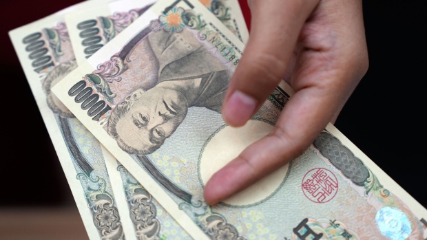 A worker holds Japanese yen banknotes at a currency exchange office in Jakarta, Indonesia, on Thursday, Oct. 5, 2023. The dollar’s relentless rally has finally toppled the last Asian currency standing, with the Indonesian rupiah joining regional peers in erasing this year’s gains against the greenback.