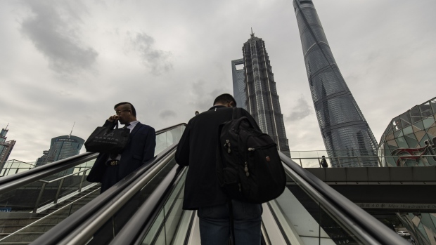 Pedestrians in Pudong's Lujiazui Financial District in Shanghai, China, on Monday, Oct. 9, 2023.  Photographer: Qilai Shen/Bloomberg