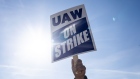 A "UAW On Strike" sign held on a picket line outside the Stellantis Sterling Heights Assembly Plant in Sterling Heights, Michigan, US, on Monday, Oct. 23, 2023. UAW union members at Stellantis NVs lucrative pickup truck plant, which makes the Ram 1500 pickup truck, walked off the job Monday morning.