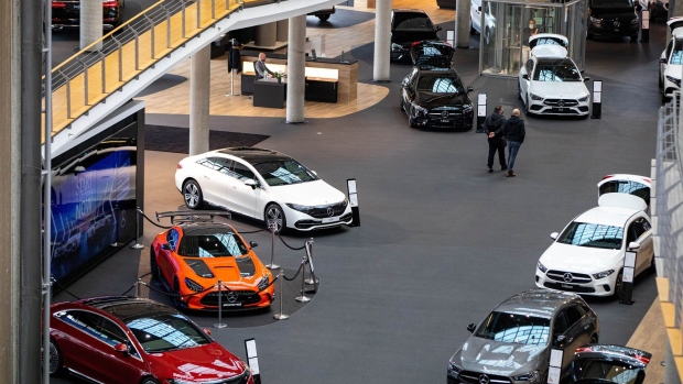 Automobiles on display inside a Mercedes-Benz AG showroom in Berlin, Germany, on Tuesday, Feb. 24, 2022. Mercedes-Benz expects profitability at its main cars division to slip this year as the German manufacturer sees more drag from supply-chain snarls and a surge in raw-material costs.