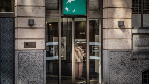 A customer uses an automated teller machine (ATM) inside a BNP Paribas SA bank branch in Lyon, France, on Monday, Sept. 25, 2023. France will announce its 2024 budget on Sept. 27.