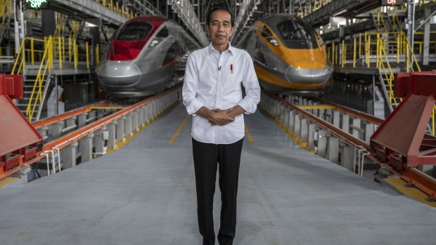 Joko Widodo, Indonesia's president, at Tegalluar station in front of Jakarta-Bandung High-Speed Railway trains in West Java, Indonesia, on Tuesday, Sept. 19, 2023. Indonesia’s outgoing president said Southeast Asia’s largest economy can attain its fastest expansion in three decades under the next leader, who will build on the reforms he’s trying to cement.