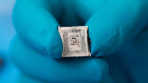 A Kirin 9000s chip fabricated in China by Semiconductor Manufacturing International Corp. (SMIC), taken from a Huawei Mate X5 foldable smartphone, in Ottawa, Ontario, Canada, on Tuesday Sept. 19, 2023. Huawei's Kirin 9000s processor supports 5G wireless speeds, TechInsights said, dispelling some of the mystery around the Chinese company's latest devices. Photographer: James Park/Bloomberg