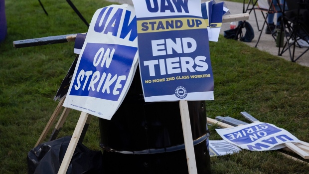 Signs at a United Auto Workers (UAW) picket line outside the Ford Motor Co. Chicago Assembly Plant in Chicago, Illinois, US, on Saturday, Sept. 30, 2023. The United Auto Workers expanded its strike against General Motors Co. and Ford Motor Co. to more assembly plants, but the union spared Jeep maker Stellantis NV from additional walkouts after a last minute breakthrough.