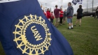 United Auto Workers members strike the General Motors Lansing Delta Assembly Plant in Lansing, Michigan. 