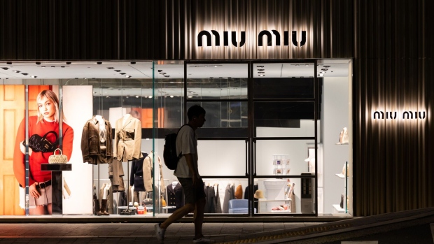 A Miu Miu store, operated by Prada SpA, at night in Seoul, South Korea, on Saturday, Aug. 19, 2023. The Bank of South Korea (BOK) is due to release the latest consumer confidence figures on Aug. 22.