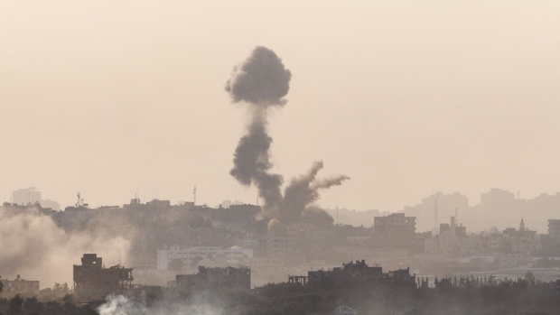 Smoke from destroyed buildings in the north of the Gaza Strip following Israeli air strikes, viewed from near Sderot, Israel, on Monday, Oct. 30, 2023.