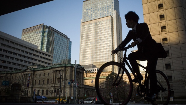 A cyclist travels past the Bank of Japan (BOJ) headquarters in Tokyo, Japan, on Wednesday, March. 8, 2023. The Bank of Japan will conclude Governor Haruhiko Kuroda’s final meeting Friday, with global investors remaining on high alert for a surprise parting shot from Kuroda that may jolt financial markets around the world.