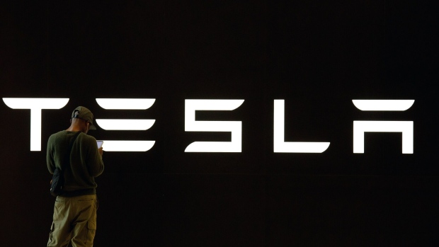 Tesla Inc. logo during a launch of company's Model Y electric vehicle in Kuala Lumpur, Malaysia, on Thursday, July 20, 2023. Tesla unveiled its mid-sized sport utility vehicle — the Model Y — at an event in downtown Kuala Lumpur on Thursday, providing a boost to the Southeast Asian nation’s efforts to promote sustainable mobility. Photographer: Samsul Said/Bloomberg