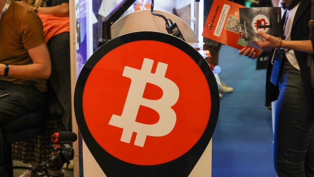 A Bitcoin sign on the opening day of the European Blockchain Convention at the Fira de Barcelona in October. Photographer: Angel Garcia/Bloomberg