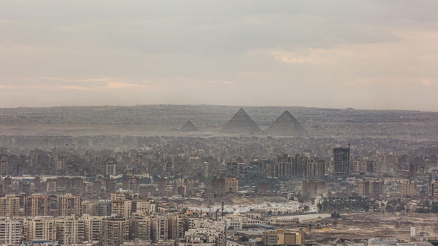 The Giza pyramid complex beyond residential and commercial buildings, viewed from Al Mokattam mountain, in Cairo, Egypt, on Saturday, Jan. 7, 2023. Egypt’s urban inflation accelerated at its fastest pace in five years as several rounds of currency devaluation filtered through to consumers.