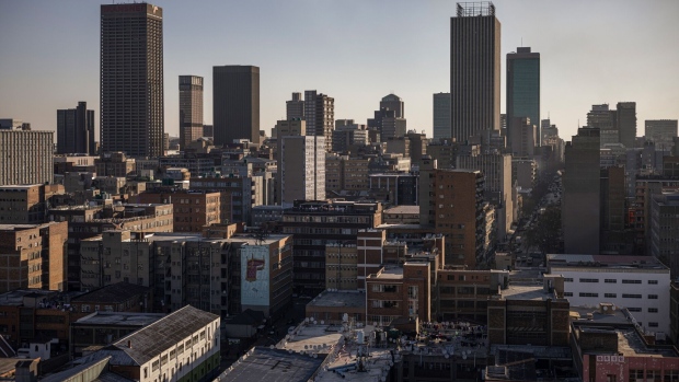 Commercial office buildings and high-rise towers beyond blocks of flats in the central business district in Johannesburg, South Africa, on Tuesday, Aug. 15, 2023. 